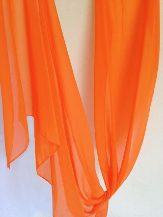 Orange-carot color in a ethereal chiffon scarf primed for you who search for an exceptional and delicate gift for a unique occasion and for your beloved ones.