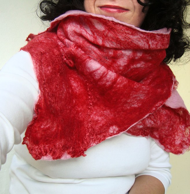 cobweb felted scarf -candy crushed- cobweb felted scarf -candy crushed- cobweb felted scarf -candy crushed- cobweb felted scarf -candy crushed- cobweb felted scarf -candy crushed- 🔎zoom  Request a custom order and have something made just for you. Item details 1 out of 5 stars.      (31) reviews Shipping & Policies This breezy and loose scarf is hand-felted with the cobweb felting technique especially for you who look for an exceptional and silky-smooth gift for a unique occasion and for your beloved ones. Make your unique moments handmade!  The scarf is made with the cobweb felt technique, thus some of its parts are transparent with some small holes. This is the fascinating part of the cobweb felt which makes it unique.  For the scarf is used extra-fine merino wool (18 mic) from Australia and New Zealand in red and pink colors. Additionally a large quantity of mulberry silk threads again in red are used in order to offer a shiny effect which adopts different hues depending on the natural light. The scarf is double-felted and has similar pattern on both sides.  It measures approximately 190 cm (74.8 in) length and 27-45 cm (10.6-17.7 in) width. This scarf’s edges are wide giving the impression of a butterfly!  Although made of wool it is soft and airy and it feels absolutely like silk!  As all scarves made by QaraQul are a unique piece!  Thank you for stopping by!  Want to experience more felted accessories? Here you are: http://www.etsy.com/shop/QaraQul Meet the owner of QaraQul Learn more about the shop and process  Katerina cobweb felted scarf -candy crushed-